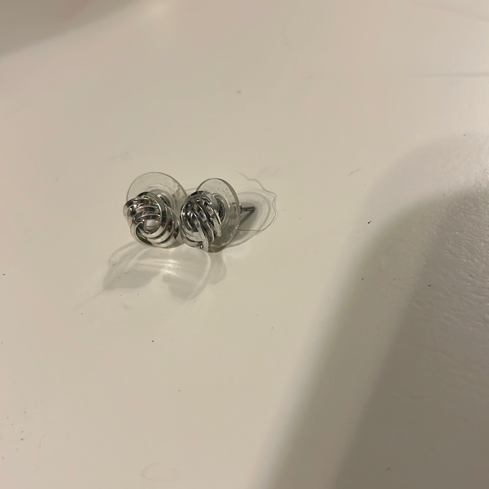 Silver earrings.
